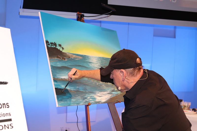 James R Hahn paints cruise artwork