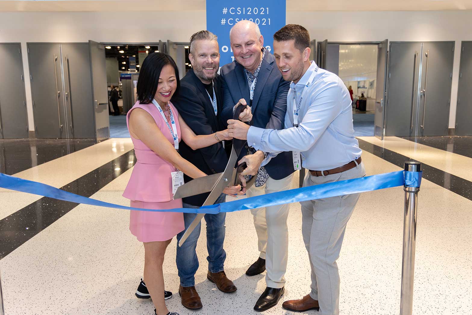 toby walters and the csi advisory board cutting the ribbon at cruise ship interiors expo america