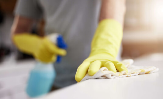 Cleaning these counters. Shot of an unrecognizable man cleaning a counter at home