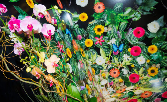 bright floral display on a booth at cruise ship interiors design expo 2023